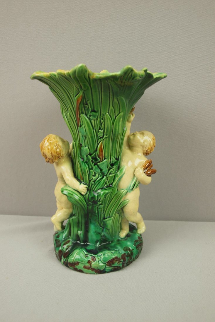 Minton (attributed) Majolica cattail vase with 2 putti,: Minton (attributed) Majolica cattail vase with 2 putti, repairs, 8 1/2"