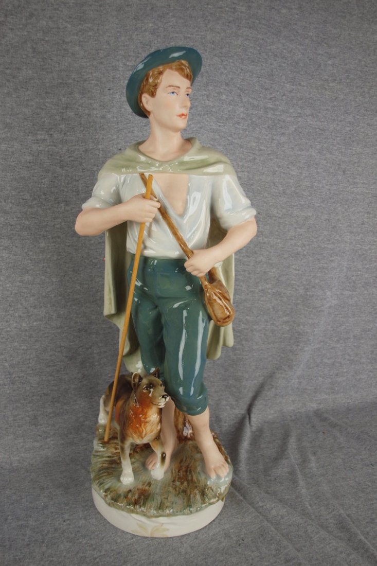 Royal Dux figure of a man with his dog, 22 1/2",: Royal Dux figure of a man with his dog, 22 1/2", hairline to man's leg