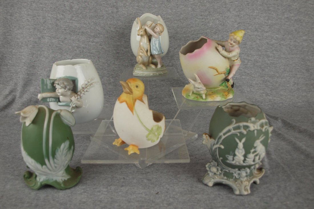 Lot of 6 German bisque porcelain figural eggs: Lot of 6 German bisque porcelain figural eggs, 3 1/2" to 5 1/2", girl with rabbit's egg has a rim nick