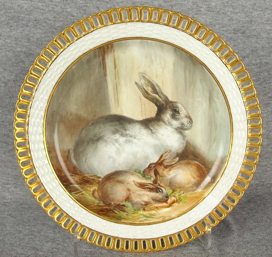 Rare, beautiful hand painted Minton plate, depicting a: Rare, beautiful hand painted Minton plate, depicting a mother rabbit and two baby rabbits, reticulated gilt edge, c1875, 9", some crazing to back and a little near the large rabbit's ears,