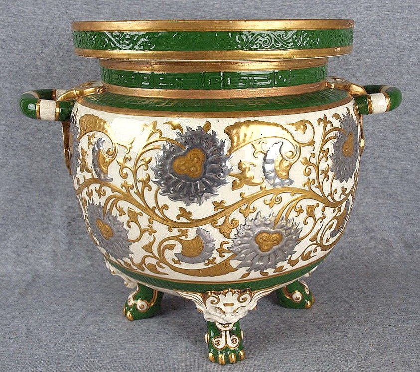 Rare Minton table jardiniere decorated platinum and: Rare Minton table jardiniere decorated platinum and 22ct gold in stylized blossoms and leaves, paw feet and 2 lug handles, crack to base. Very rare to see this gilded version. Illustrated in "The Cera