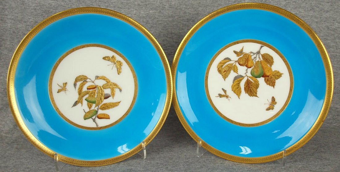 Pair of Minton aesthetic movement plates decorated with: Pair of Minton aesthetic movement plates decorated with wide border of turquoise enamel with Japanese style gold and platinum fruit and insects, c1875, 9"
