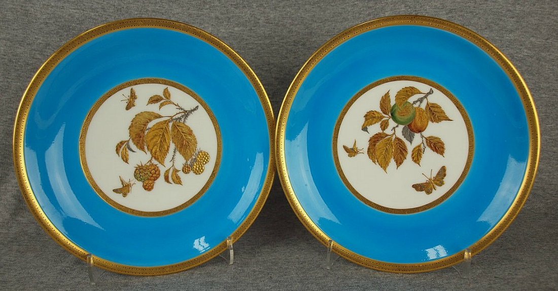 Pair of Minton aesthetic movement plates decorated with: Pair of Minton aesthetic movement plates decorated with wide border of turquoise enamel with Japanese style gold and platinum fruit and insects, c1875, 9"