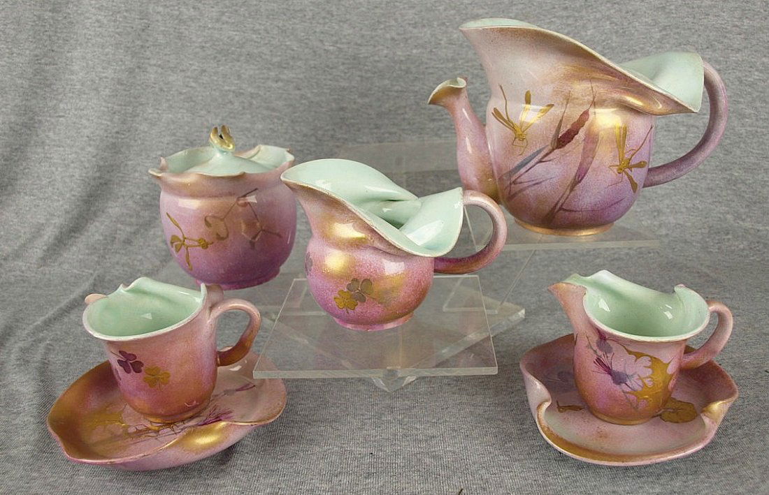 Very rare Clement Massier Japanism art nouveau teaset: Very rare Clement Massier Japanism art nouveau teaset in a pale pink background with Japanese style gilded insects, c1900, various chips restored. A similar example at the Brooklyn Museum.