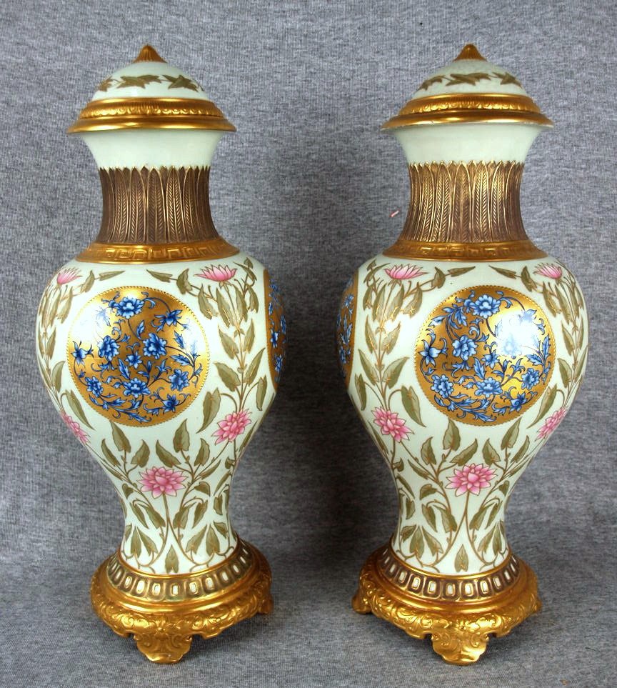 Rare pair, excellent quality, of Mintons aesthetic: Rare pair, excellent quality, of Mintons aesthetic movement bone china lidded mantle vases, celadon bodies decorated with Japanese style flowers, 17", one foot professionaly repaired, one lid with 'di