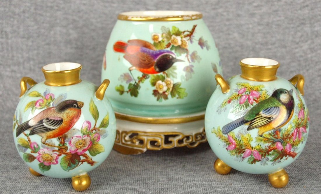 A very pretty lot of Royal Worcester bone china: A very pretty lot of Royal Worcester bone china spherical hand painted vases decorated with birds and blossoms on a duck egg green ground, c1875, 4 1/2" and a Royal Worcester bone china pair of aesthe