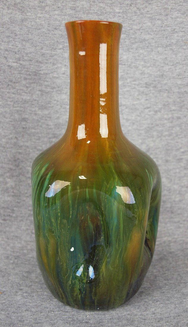 A Linthorpe bottle vase signed by Christopher Dresser,: A Linthorpe bottle vase signed by Christopher Dresser, c1880 10", small chip to top edge professionally repaired, 'example shown in Christopher Dresser 1834-1904, Michael Whiteway,2001, image 116, pag