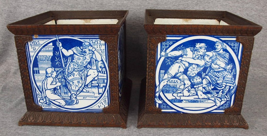 A pair of Minton aesthetic movement iron planters with: A pair of Minton aesthetic movement iron planters with 8 Minton tiles designed by John Moyr Smith, c1870