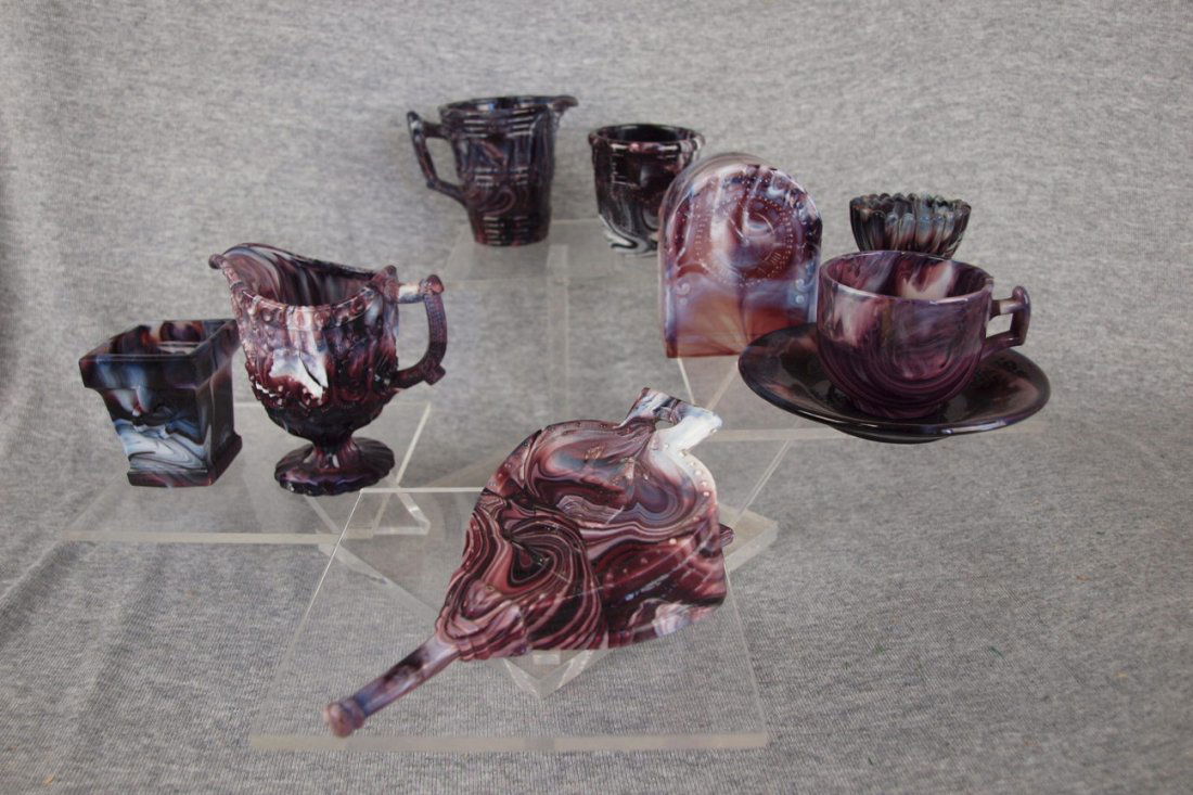 Early purple slag lot of novelty pieces: creamers,: Early purple slag lot of novelty pieces: creamers, thimble, cup & saucer, radio, bellows & more