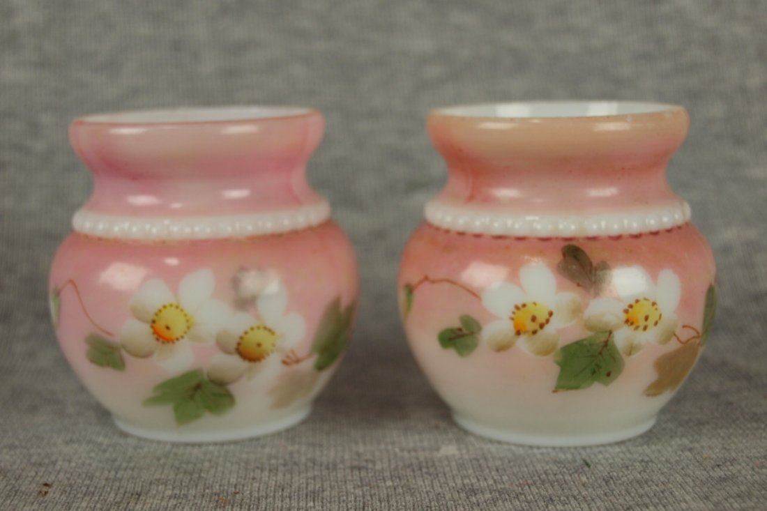 Consolidated milk glass lot of 2 toothpick holders with: Consolidated milk glass lot of 2 toothpick holders with floral motif, nick