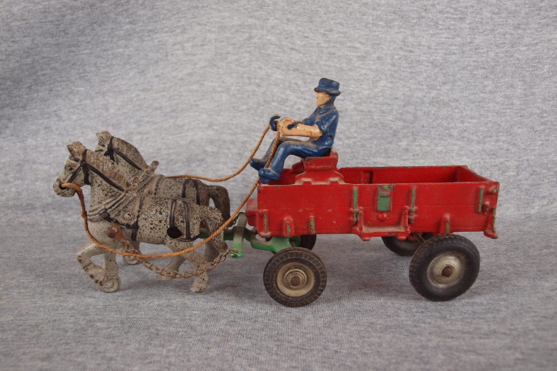 Arcade cast iron farm wagon, team of 2 horses and rider: Arcade cast iron farm wagon, team of 2 horses and rider