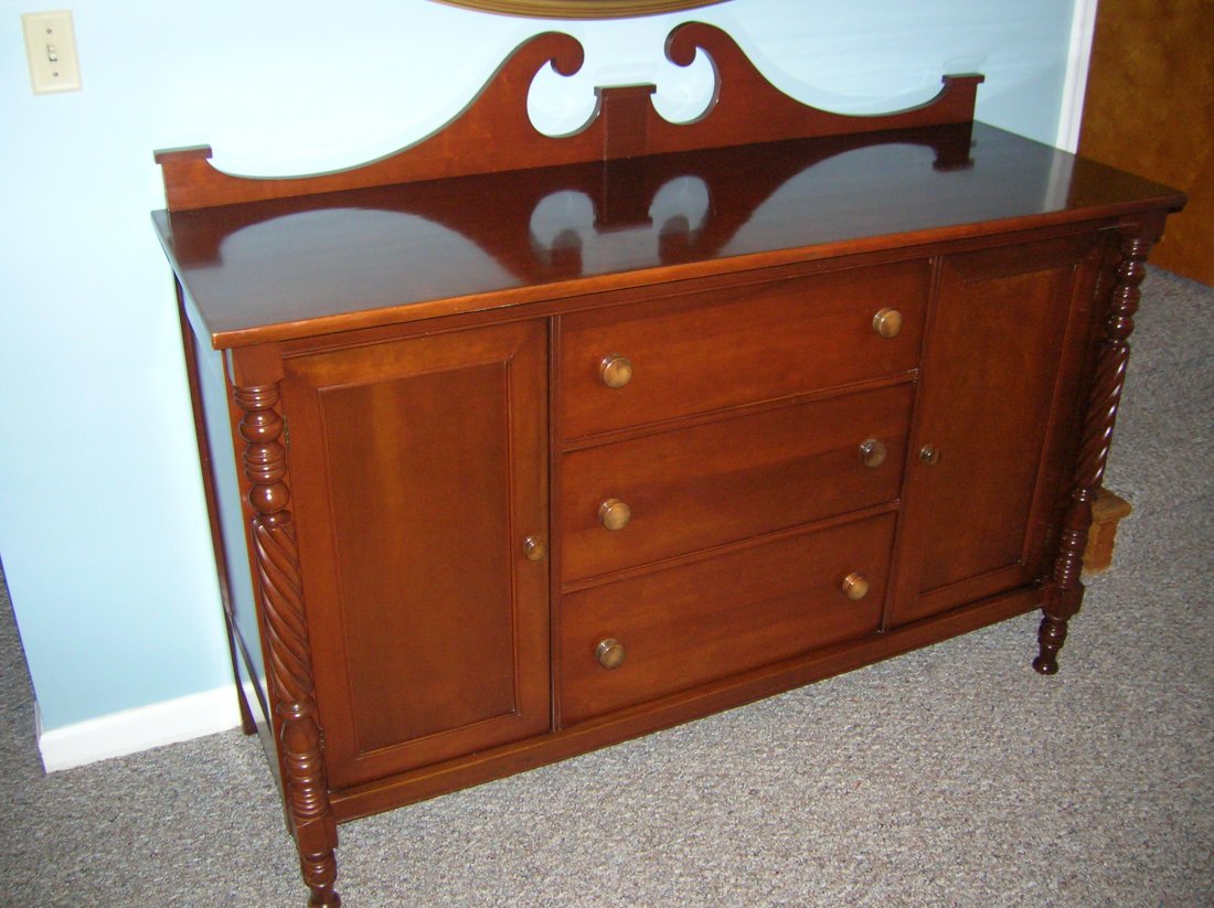 Park brand cherry 8 piece dining room suite: Park brand cherry 8 piece dining room suite with Duncan Phyfe style drop leaf table with leaves and pad, 6 chairs and buffet. Excellent condition. Two matching corner cabinets with be sold seperately