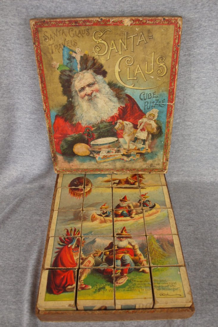 McLoughlin Bros Santa Claus Travels picture cube puzzle: McLoughlin Bros Santa Claus Travels picture cube puzzle with original box, 1897, blocks are in good condition with minor wear. Photos have some losses.
