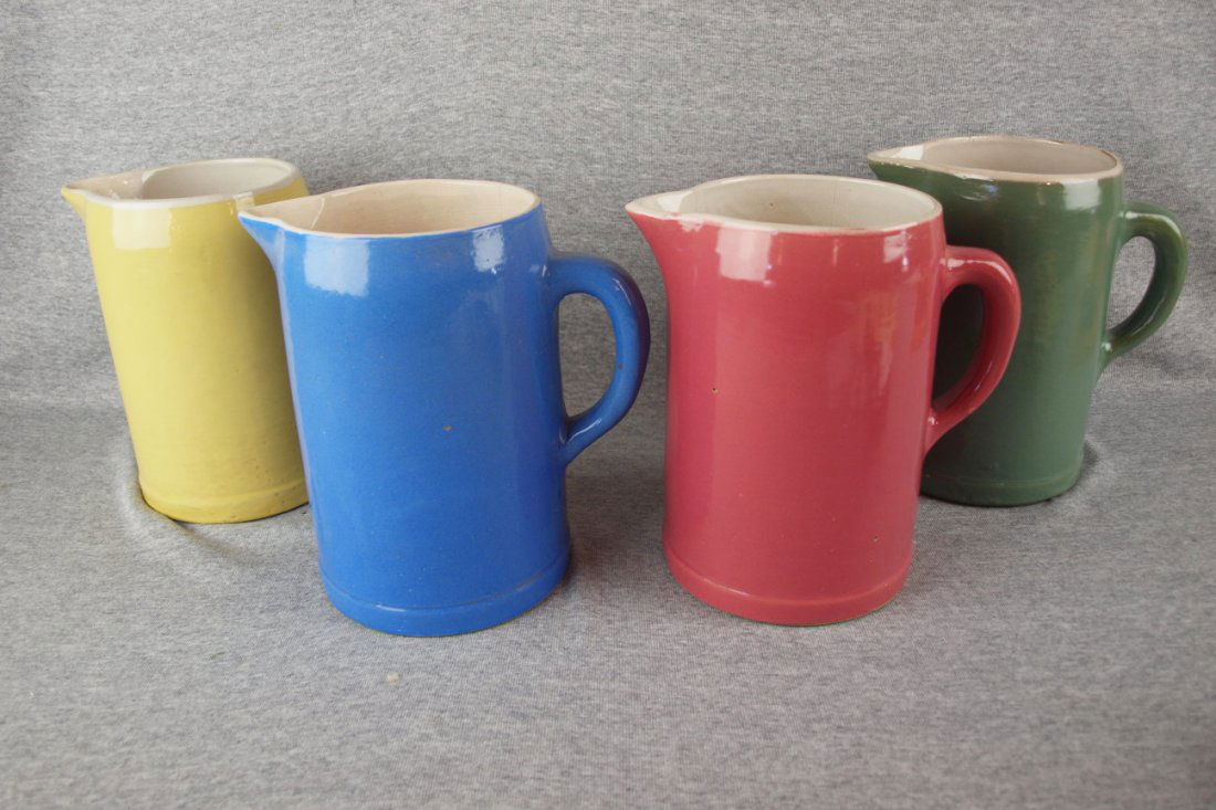 Uhl Pottery lot of 4 smooth side pitchers - 8 1/2" yell: Uhl Pottery lot of 4 smooth side pitchers - 8 1/2" yellow, blue(hairline), pink(hairline), & green(hairline)