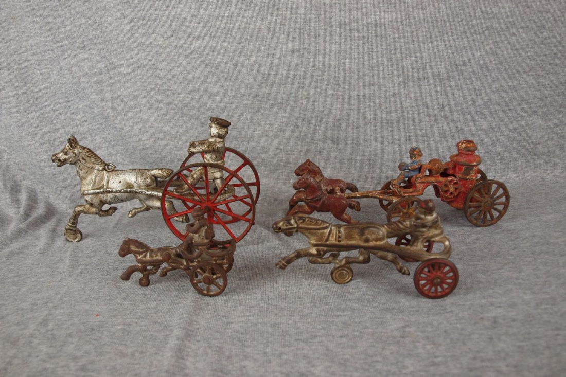 Cast iron lot of 3 pony & sulkies & one fire engine: Cast iron lot of 3 pony & sulkies & one fire engine
