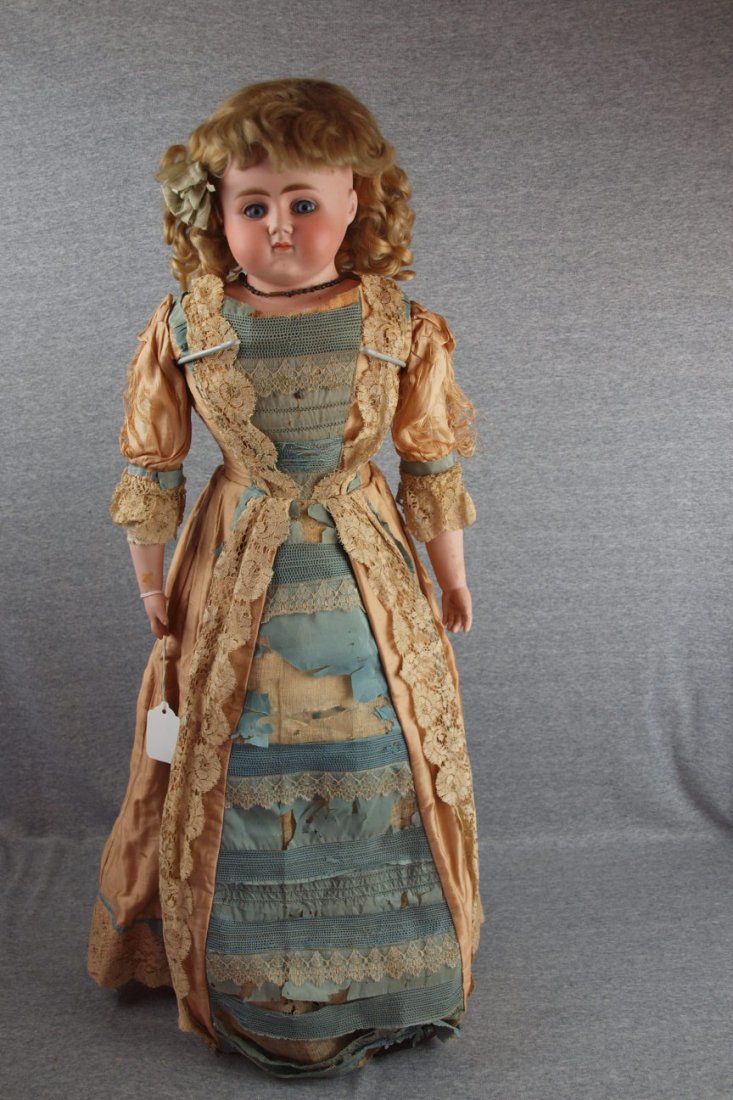 Early large bisque head doll with bisque arms, straw bo: Early large bisque head doll with bisque arms, straw body, 34"