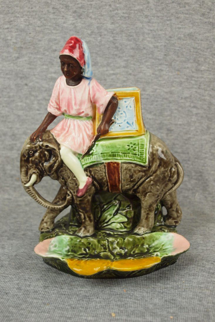 Majolica Continental figural match striker of: Majolica Continental figural match striker of Blackamoor riding elephant, professional rim repair, 7 1/2"