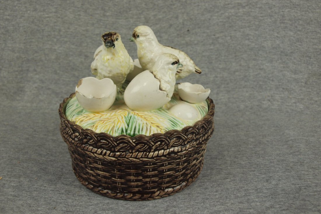 Majolica Continental chicks & eggs on basket covered: Majolica Continental chicks & eggs on basket covered dish, nicks to egg shells & lid rim, 6 1/2"d