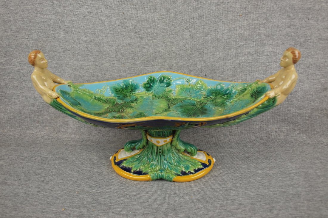 Majolica George Jones table center with mythological: Majolica George Jones table center with mythological men handles, professional repair to heads of handles & rim, 16"w 8"h