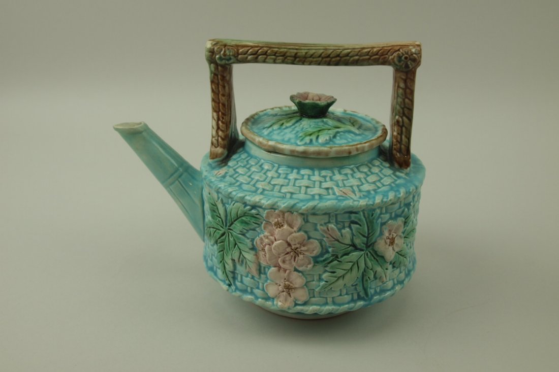 Majolica turquoise basket and floral teakettle: Majolica turquoise basket and floral teakettle, 6", spout repair