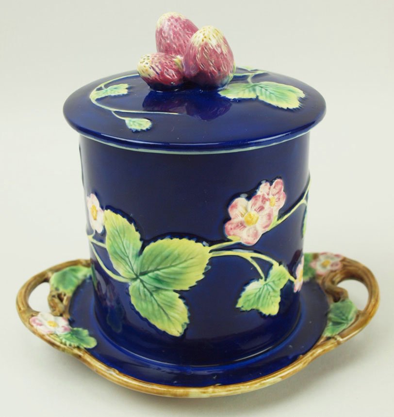 An extremely rare and excellent quality George Jones: An extremely rare and excellent quality George Jones Majolica strawberry preserve jar and cover modeled as a cobalt jar with fixed under plate with brown twig edging and handles, the body and lid with