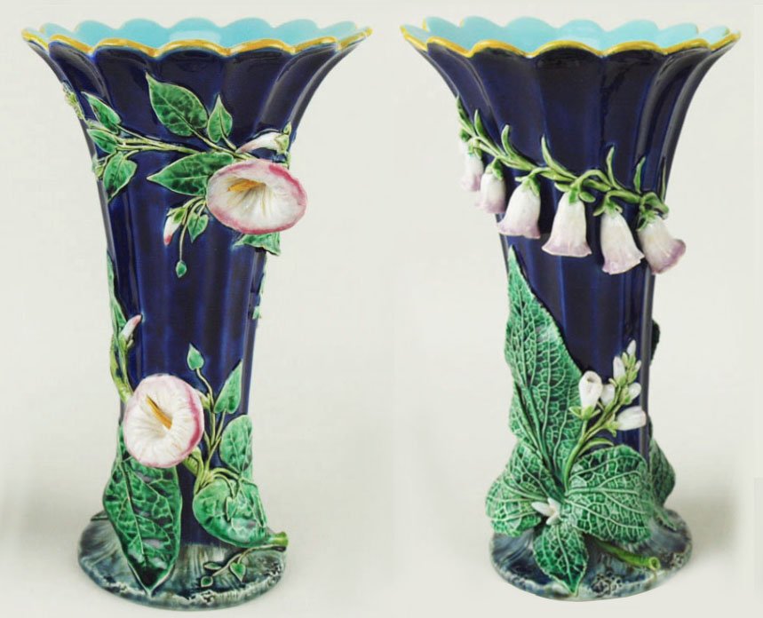A beautiful and rare pair of Minton Majolica mantle: A beautiful and rare pair of Minton Majolica mantle vases c.1875, each modeled as a cobalt ground, fluted trumpet shape vase supported on a rocky ground. One vase with convolvulus plants spiraling aro