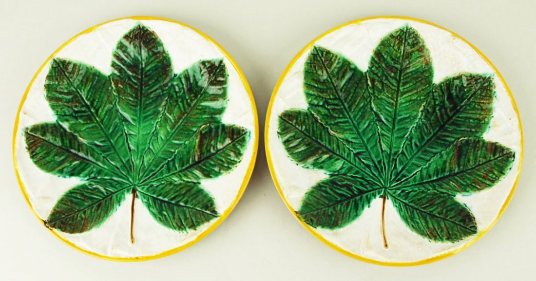 Two George Jones Majolica chestnut leaf plates c.1875,: Two George Jones Majolica chestnut leaf plates c.1875, modeled as a large chestnut leaf laying on a white napkin with an orange border, 9”d 'CURATED & CATALOGUED BY NICOLAUS BOSTON'