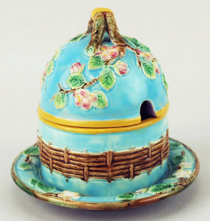 A charming George Jones Majolica ‘Apple Blossom’: A charming George Jones Majolica ‘Apple Blossom’ preserve jar and lid c.1875, the turquoise body with fixed under plate having a band of basket weave to the middle and trailing apple blossom to th
