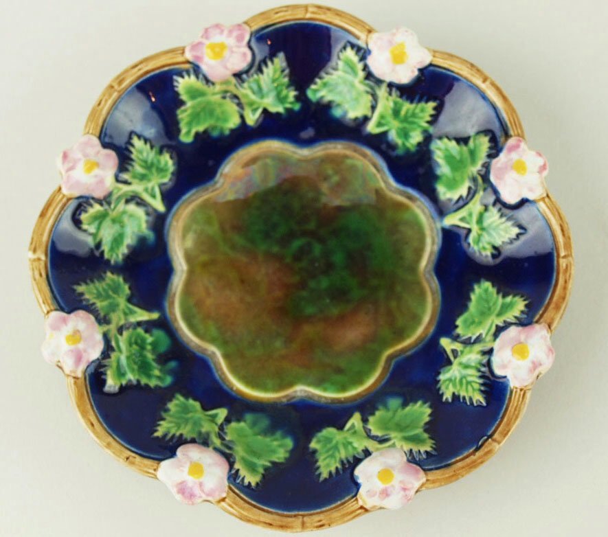 A rare George Jones pickle dish c.1875, the shaped: A rare George Jones pickle dish c.1875, the shaped dish with a cobalt ground decorated with a repeating pansy pattern against a brown twig border, the centre being mottled or ‘snake skin’ as this