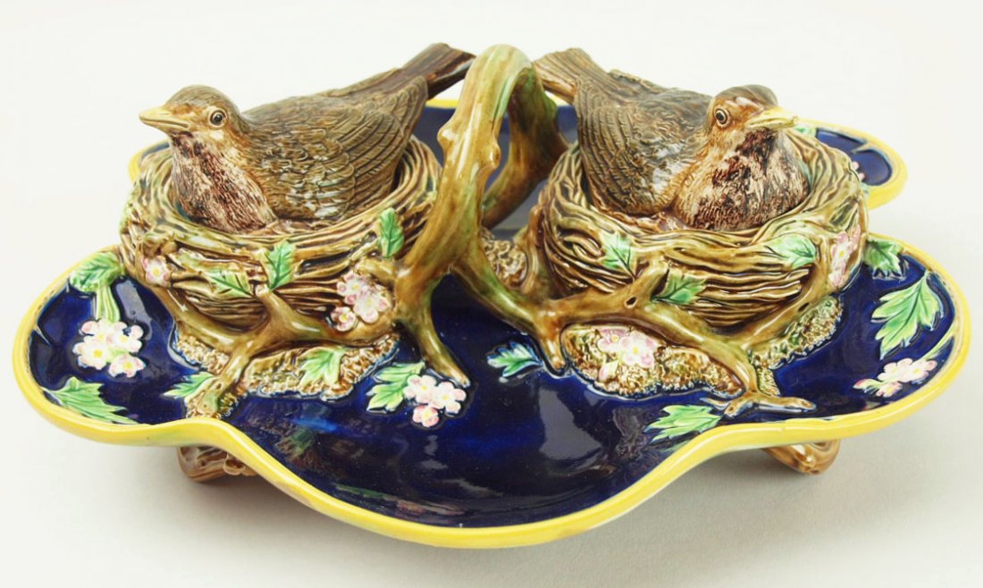 A very rare George Jones Majolica double inkwell: A very rare George Jones Majolica double inkwell c.1875, modeled as a shaped cobalt tray with an orange border and supported on twig feet. Two birds nests surrounded by apple blossom for the ink pot h