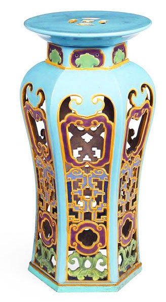 A Minton Majolica pedestal in the Chinese style: A Minton Majolica pedestal in the Chinese style c.1875, designed as a hexagonal baluster shaped pedestal with panels of elaborate Chinese style fret work picked out in bright colours all on a turquois