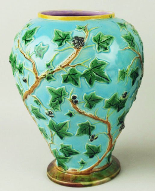 A very rare George Jones ivy vase c.1875, the bulbous: A very rare George Jones ivy vase c.1875, the bulbous shape with a turquoise ground covered in ivy leaves all on a brown circular base with a pink interior, 9”h 'CURATED & CATALOGUED BY NICOLAUS BOS