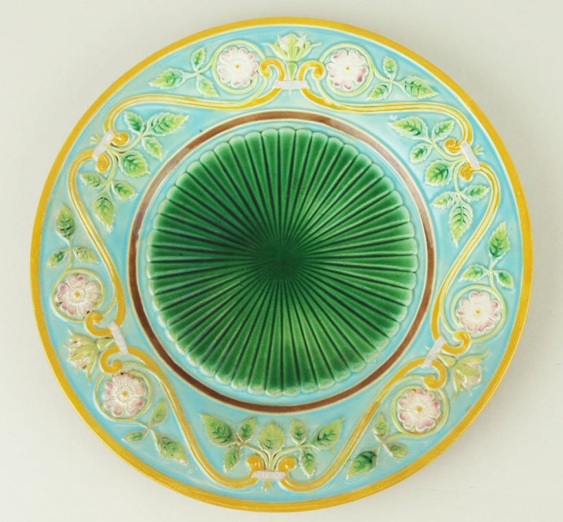 A George Jones Neo-Classical design dessert plate: A George Jones Neo-Classical design dessert plate c.1875, with radiating emerald green centres and a turquoise border and stylized scrolling, leaves, and blossoms with an orange border, 9” 'CURATED 