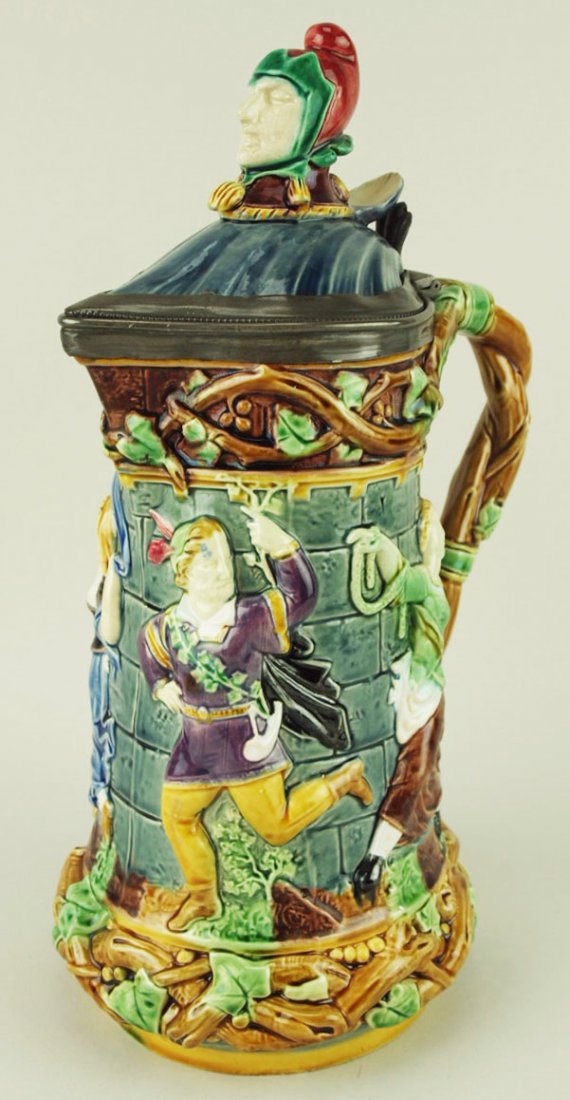 A Fine Minton Majolica Medieval Revival ‘Tower’ Beer: A Fine Minton Majolica Medieval Revival ‘Tower’ Beer Jug c.1865. Named as the ‘Tower Jug’, modeled with medieval revellers dancing around an ivy clad castle tower with branch handle and a hi