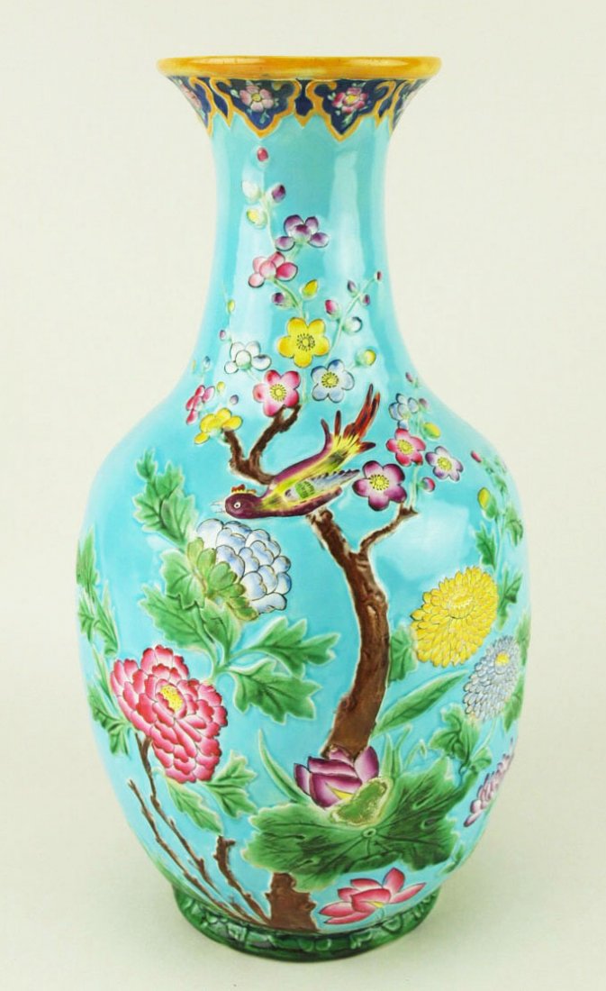 A Minton Majolica Chinoiserie vase c.1875, designed as: A Minton Majolica Chinoiserie vase c.1875, designed as an elegant turquoise ground bottle vase beautifully decorated with Chinese style peonies and exotic birds, 14”$ 'CURATED & CATALOGUED BY NICOLA