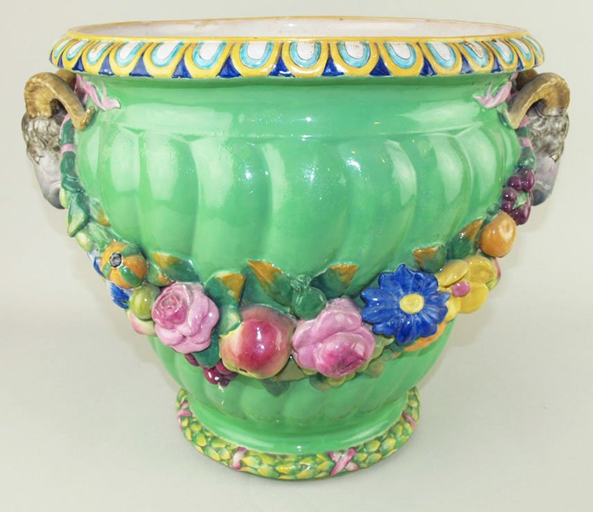 Rare Minton Majolica Apple Green ‘Garden Pot-Rams Head: Rare Minton Majolica Apple Green ‘Garden Pot-Rams Head Festoon’ designed by Baron Carlos Marrochetti c.1860, the spirally fluted body hung with swags of fruit and flowers from rams-head handles on