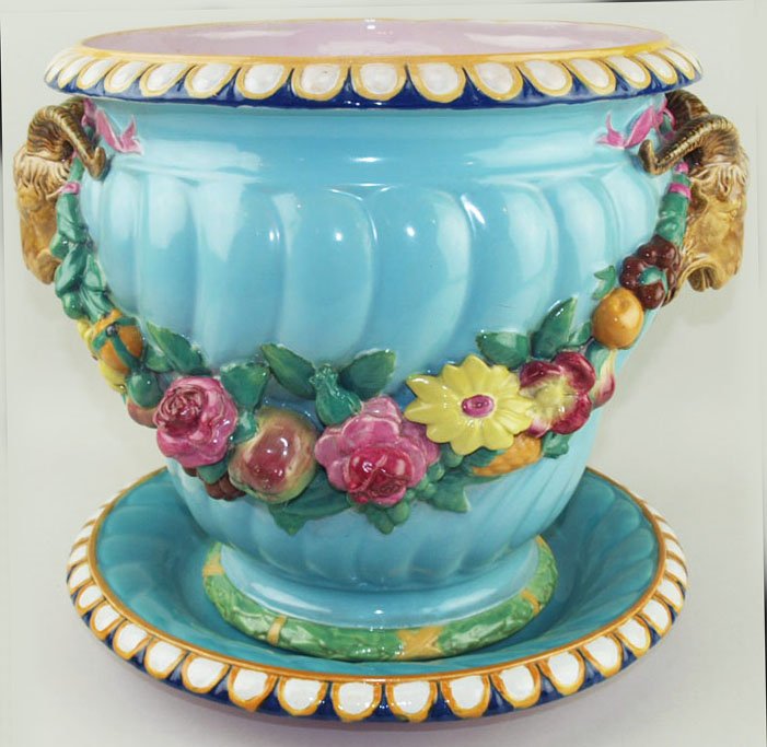 Minton Majolica ‘Garden Pot-Rams Head Festoon’: Minton Majolica ‘Garden Pot-Rams Head Festoon’ designed by Baron Carlos Marochetti c.1860, the turquoise spirally fluted body hung with swags of fruit and flowers from rams-head handles. The flute