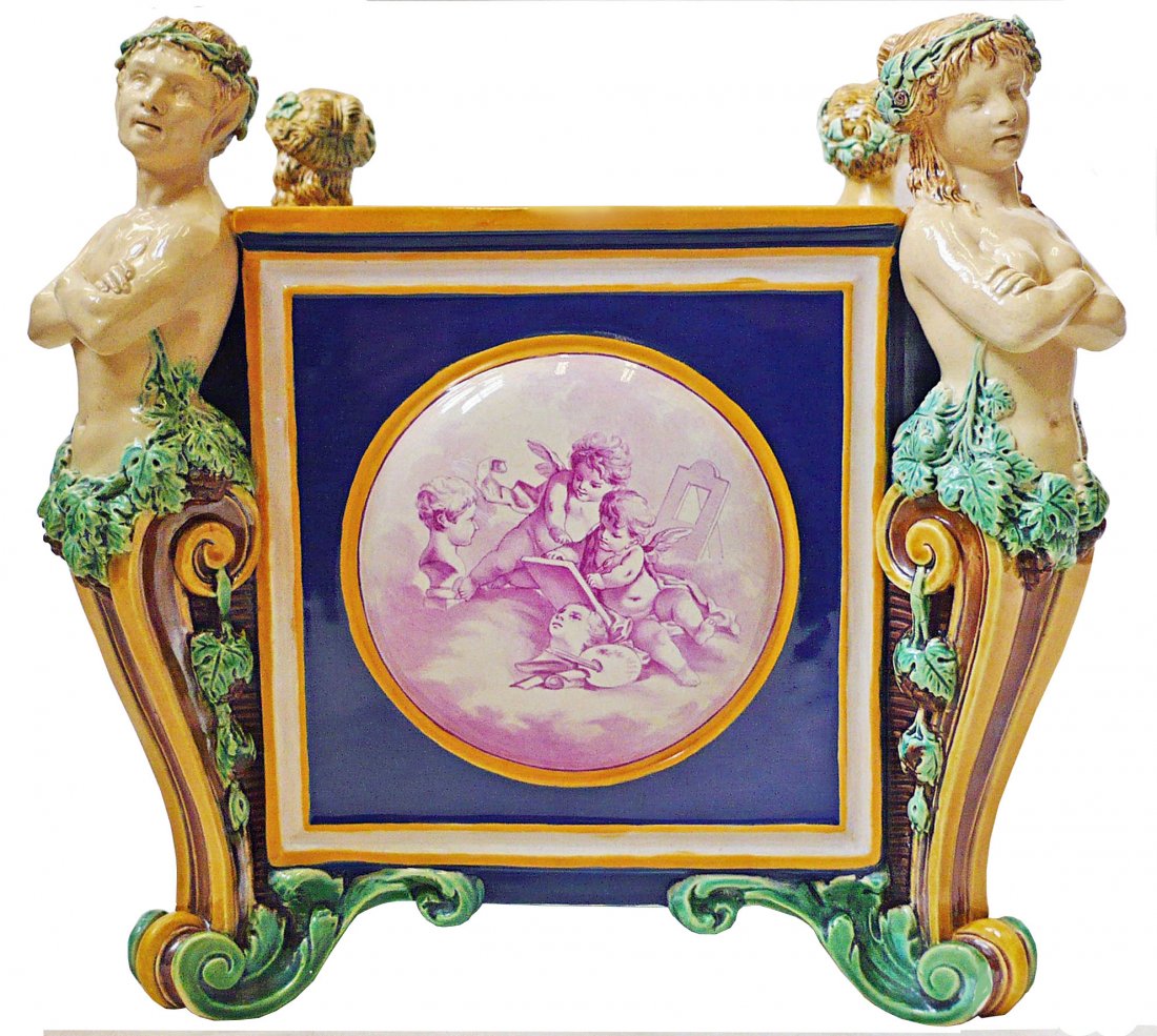 A rare and elegant Minton Majolica jardiniere c.1875: A rare and elegant Minton Majolica jardiniere c.1875 with painted panels by Antoine Boullemier. The four sided jardiniere with a caryatid and satyr to each corner, and circular panels with beautifully