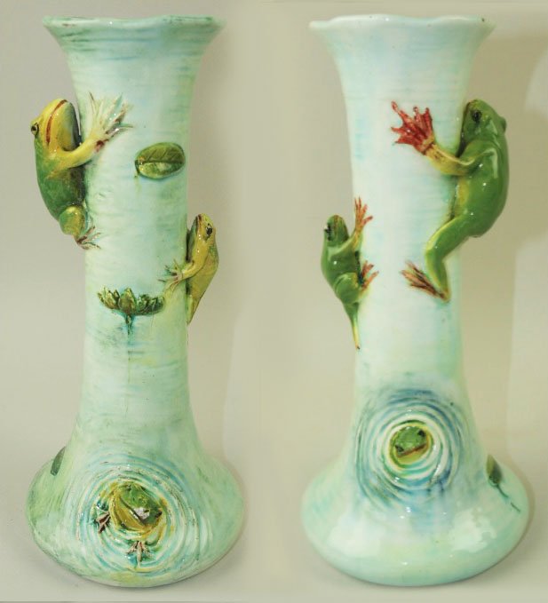 A very rare and humorous pair of Delphin Massier: A very rare and humorous pair of Delphin Massier Majolica mantle vases c.1880, 10”h, shape no 1426. Each modeled as a slim necked, wide bottomed vase, decorated as a watery blue pond full of emerald