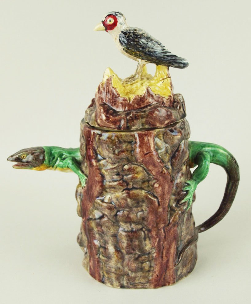 A Rare & Eccentric Raphael Bordalo Pinheiro Tree Trunk: A Rare & Eccentric Raphael Bordalo Pinheiro Tree Trunk teapot c.1890. Designed as a well molded and coloured tree trunk with a protruding lizards head forming the spout with its back half with tail fo