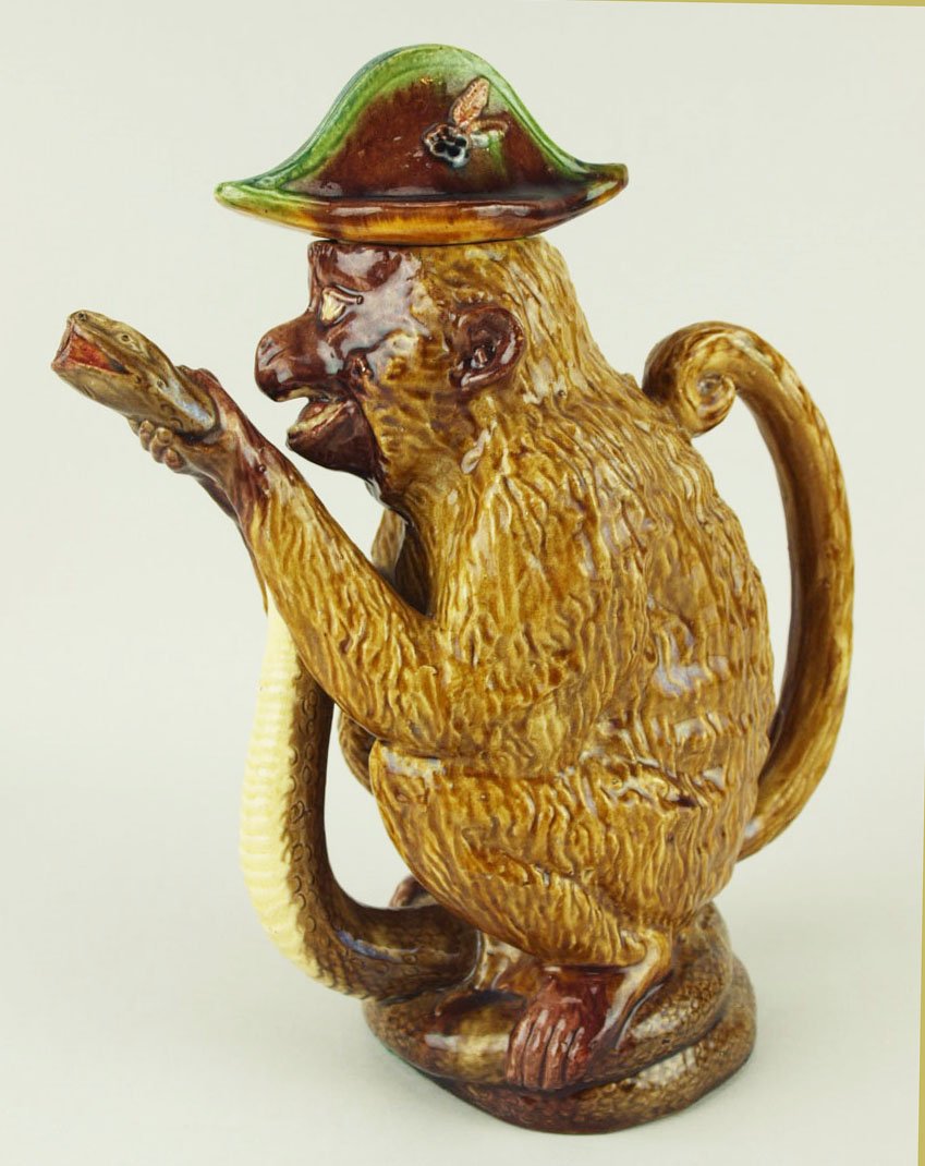 An Amusing & Very Good Quality Jose Cuhna, Caldas De: An Amusing & Very Good Quality Jose Cuhna, Caldas De Raihna, Monkey and snake teapot c.1875 Modeled as a grinning monkey crouched on a coiled snake & gripping it around the throat to form the spout, t