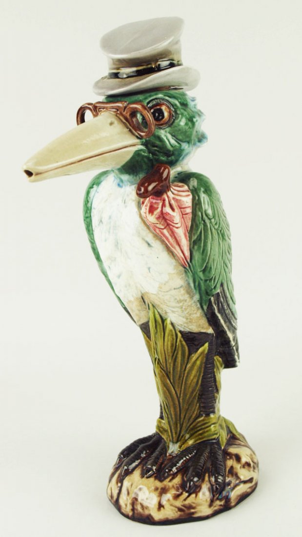 A Very Rare Half size Krause Majolica Miniature Heron: A Very Rare Half size Krause Majolica Miniature Heron in a top hat decanter c.1890 Modeled as a very smart looking heron with a pair of spectacles, a grey top hat and an umbrella under his wing. 'CUR