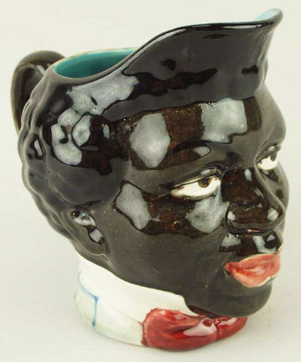 A Rare Sarreguemines Majolica water pitcher ‘Le: A Rare Sarreguemines Majolica water pitcher ‘Le Noir’Shape number 3884 Modeled as a black man with a red bow tie Provenance: Helen Cunningham 'CURATED & CATALOGUED BY NICOLAUS BOSTON'