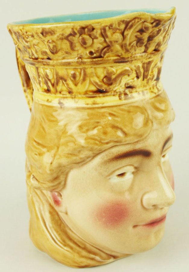 A Rare Sarreguemines water pitcher “The Norwegian: A Rare Sarreguemines water pitcher “The Norwegian Lady” c.1880 Shape# 3331 Modeled as a blonde haired woman wearing a crown.Although the subject of this pitcher is not known it is thought to be of