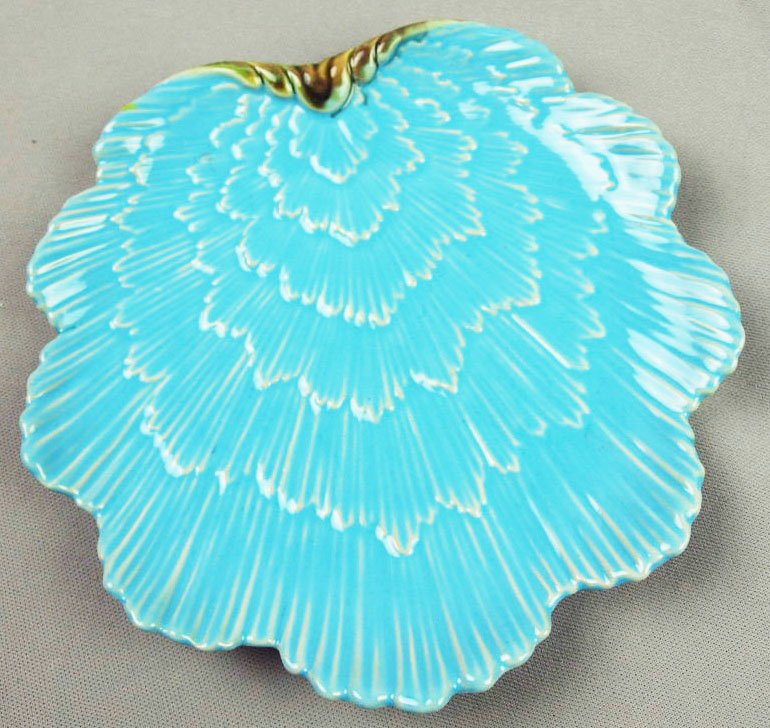 A Rare George Jones Majolica dessert plate c.1875: A Rare George Jones Majolica dessert plate c.1875 Modelled as shell shaped turquoise wave with the rolled over crest showing the green and brown mottling from the underside, 8”. 'CURATED & CATAL