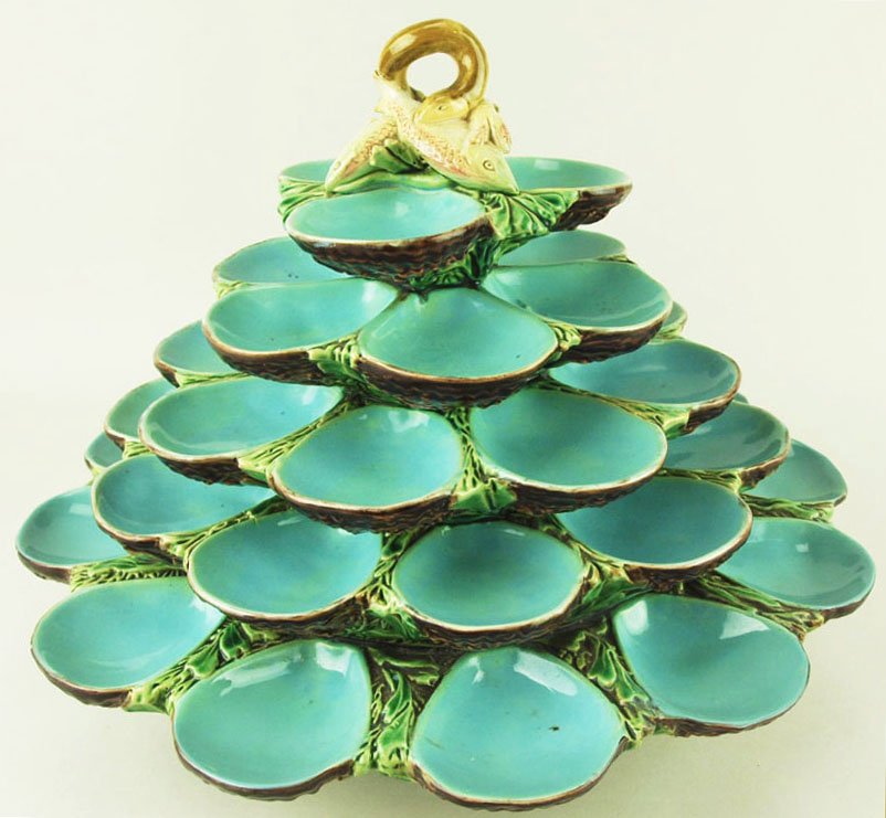 A Previously Unrecorded Minton Majolica Five Tier: A Previously Unrecorded Minton Majolica Five Tier Turquoise Well Oyster Server C.1865 Designed as five graduated tiers of turquoise glazed shell compartments surmounted by a pair of entwined fishes