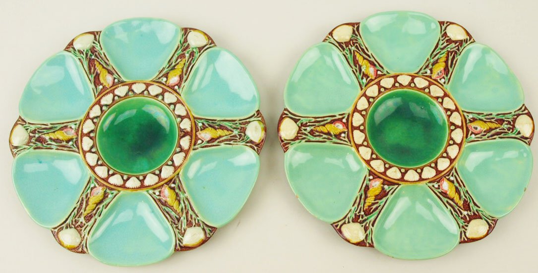 A Fine Quality Pair Minton Majolica 6 well oyster: A Fine Quality Pair Minton Majolica 6 well oyster plates c.1875 Modeled as a circular plate with six duck egg green wells separated by shells and seaweed, the emerald green circular central well surro