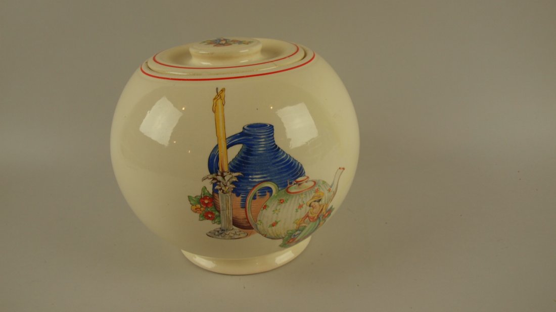 Kitchen Kraft OvenServe large covered jar with rare: Kitchen Kraft OvenServe large covered jar with rare decal of lady with jug, candle & tea pot with decal of man on lid (hairline to lid & rim nick to jar), reference Huxford's 10th, pg 206