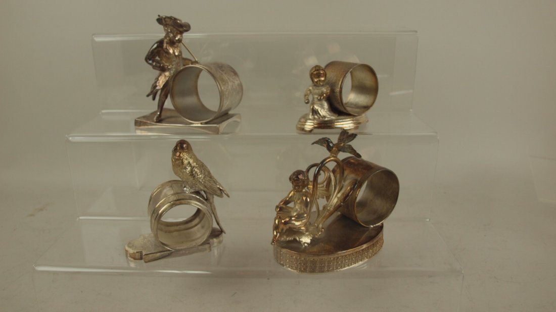 Lot of 4 figural napkin rings - monkey, child, bird,: Lot of 4 figural napkin rings - monkey, child, bird, lady