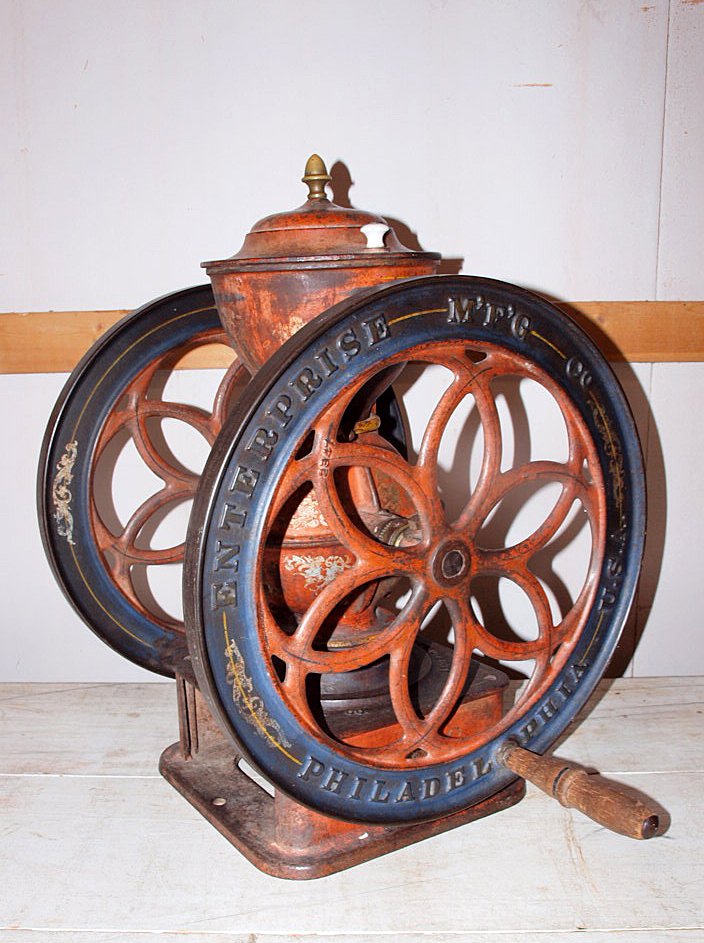 Enterprise cast iron double wheel coffee grinder, 26"h,: Enterprise cast iron double wheel coffee grinder, 26"h, wheels 19 1/2"d, some wear